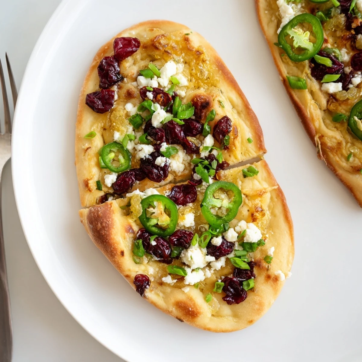 Zesty ginger cranberry jalapeño flatbread, golden-brown and bursting with flavor.