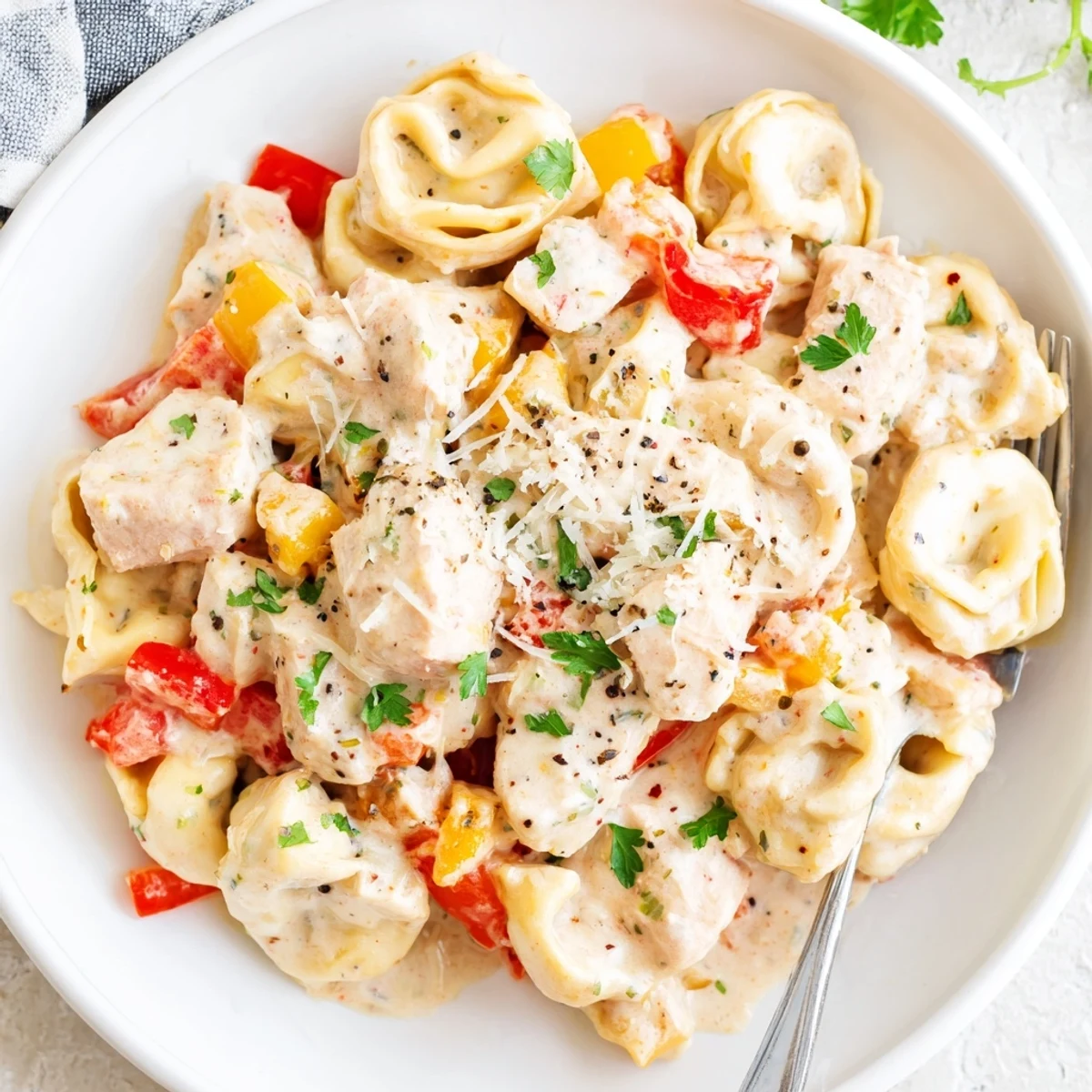 Tender chicken and cheesy tortellini in zesty Cajun garlic Parmesan sauce.  