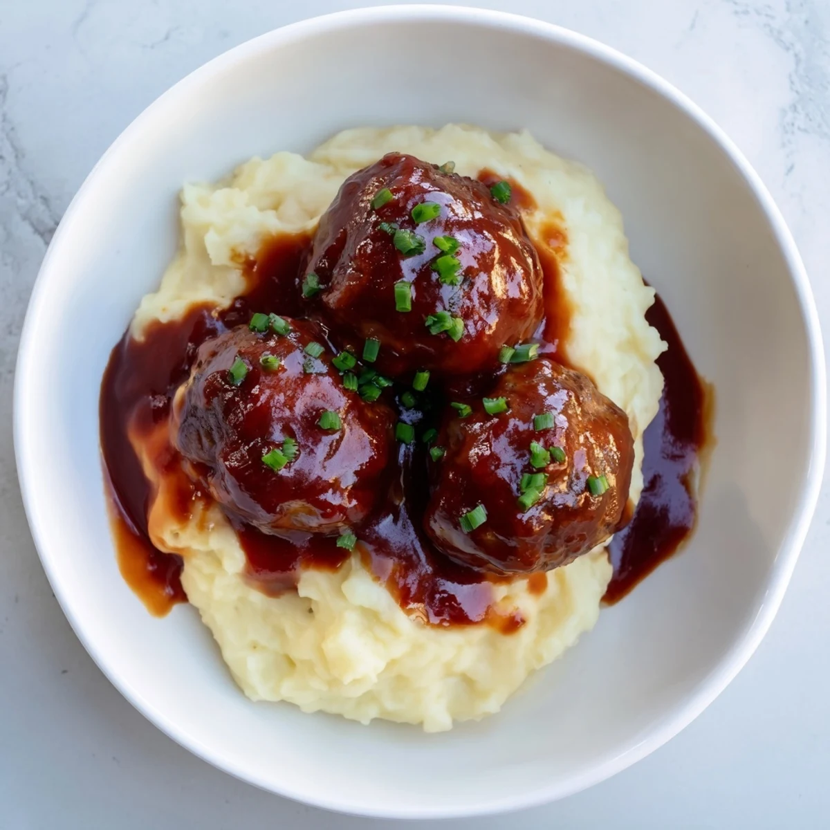 Warm, comforting BBQ Meatballs & Mashed Potatoes, ready to be enjoyed with a perfect balance of flavors and textures.