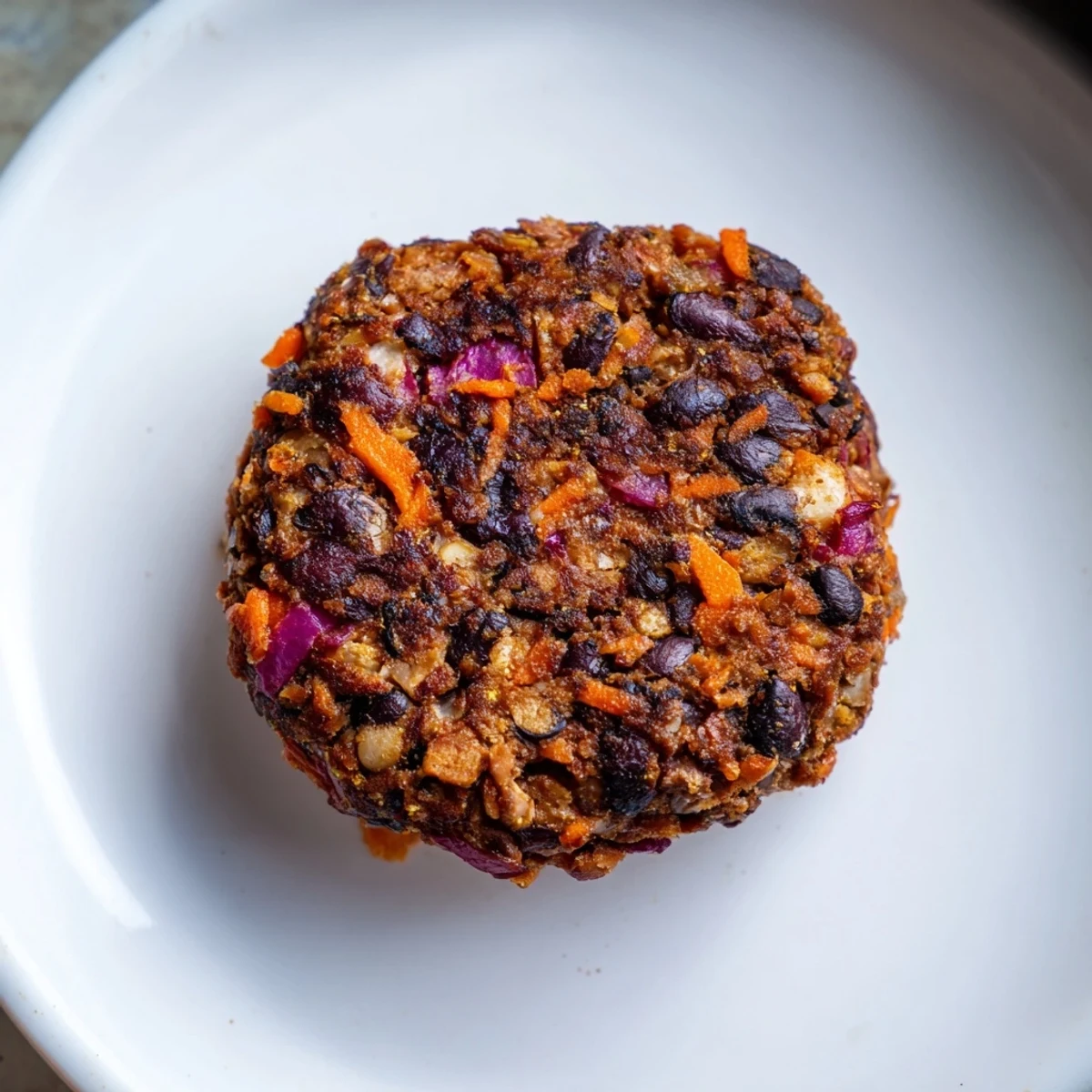 Golden-brown black bean burgers ready to be piled high with fresh toppings and served.