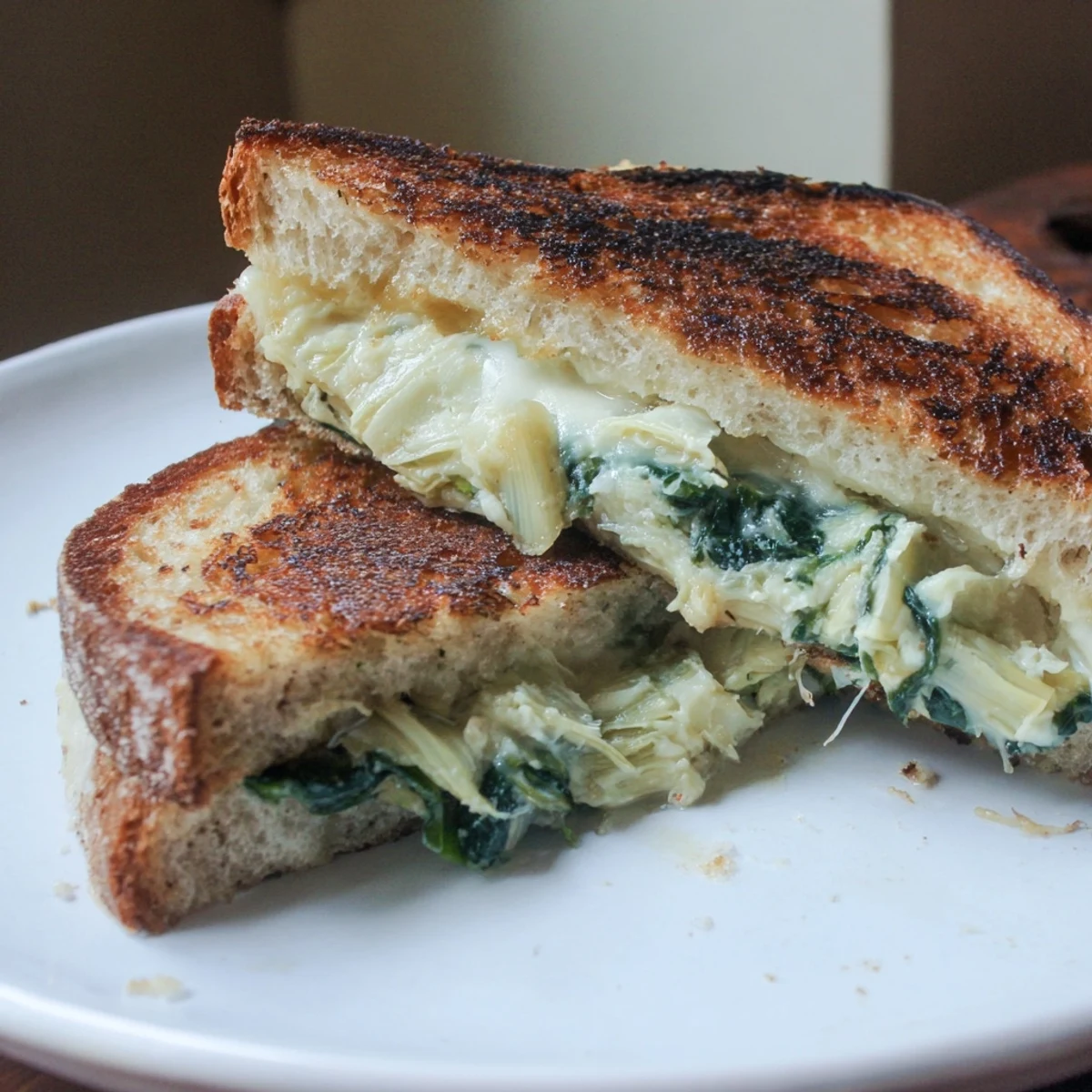 Crispy sourdough Air Fryer Spinach & Artichoke Dip Grilled Cheese sandwich, a creamy, cheesy delight.
