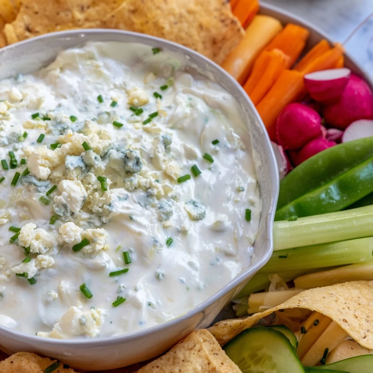 Vibrant Frozen Pond Blue Dip Platter, a stunning appetizer with blue cheese dip and colorful dippers.