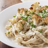 Roasted Cauliflower Alfredo sauce over pasta, featuring golden-brown roasted cauliflower florets blended with garlic and nutmeg.
