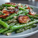 Golden roasted green beans tossed with garlic and finished with bright lemon zest for Easter dinner.  