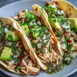 Juicy salsa verde chicken filling warm tortillas, perfect for a quick weeknight meal.