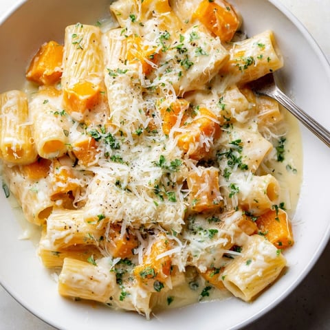 Golden Alfredo Butternut Squash Pasta Bake bubbling in a dish, ready for a comforting meal.