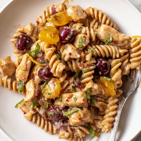 Close-up of Cherry Jalapeño Chicken Pasta: vibrant colors and creamy, savory fusion.