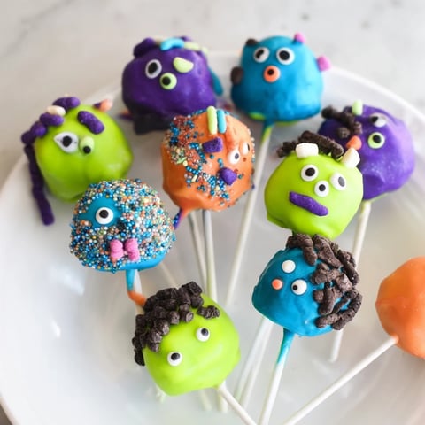 Whimsical Silly Monster Cake Pops adorned with bright colors and playful candy eyes.  