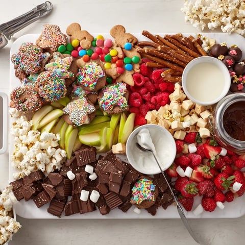 A colorful dessert board with themed snacks, perfect for festive gatherings.  