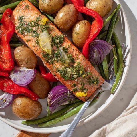 Succulent Lemon Herb Salmon & Potato Sheet Pan meal with vibrant roasted veggies.  