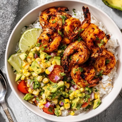 Fresh Easy Grilled Shrimp Bowl with Avocado Corn Salsa served over fluffy rice.  