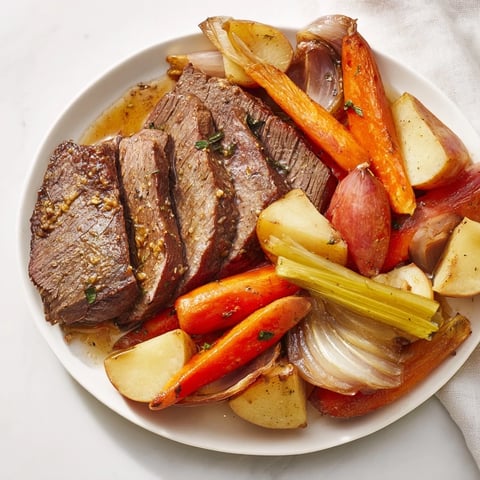 Mouthwatering Sunday Pot Roast with roasted veggies served in a cozy family setting.  