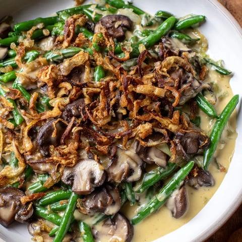 Classic Old-School Green Bean Casserole, topped with crispy onions, bubbling hot from the oven.