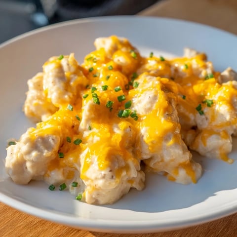 Golden, bubbly Cheddar Ranch Chicken Bake topped with melted cheese, ready for serving hot.