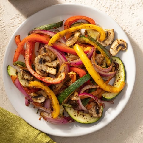 Vibrant Veggie Skillet Fajitas sizzling in a hot skillet, ready to be wrapped in a warm tortilla.