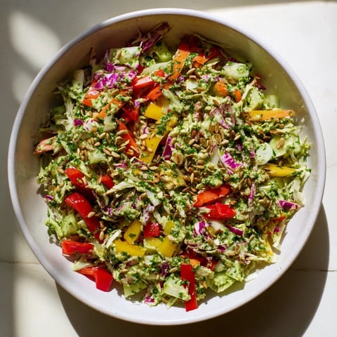 Crisp Green Goddess Confetti Chop Slaw with vibrant vegetables, dressed and tossed.