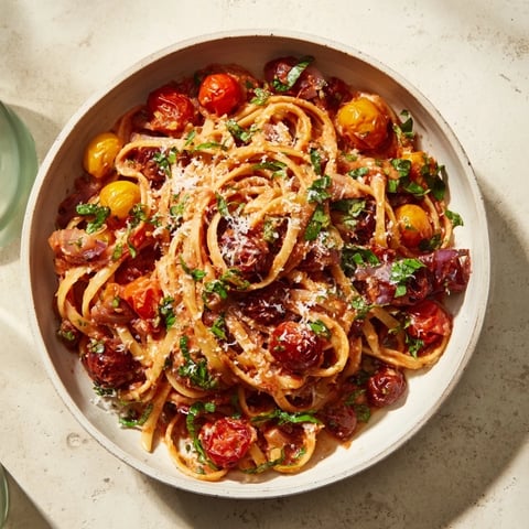 Steaming Cozy Fireplace One-Pan Tomato Basil Pasta with delicious, fresh basil and ripe tomatoes.