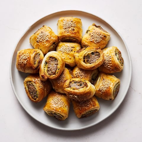 Savory Bites Mini Sausage Rolls arranged as a golden, inviting half-circle wreath, perfect for sharing.