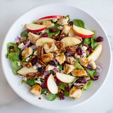 Chicken and Apple Winter Salad: A close-up of the flavorful salad with chicken, apples, and crunchy pecans.
