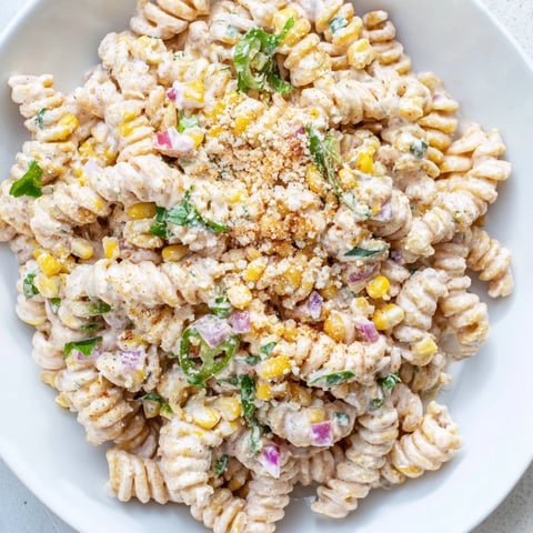 Creamy Street Corn Pasta Salad with charred corn kernels and a vibrant, creamy dressing.
