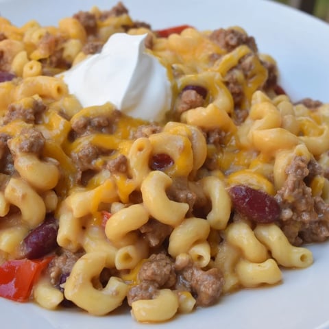 Golden, cheesy One-Pot Chili Mac in a large pot, steaming and ready to serve.