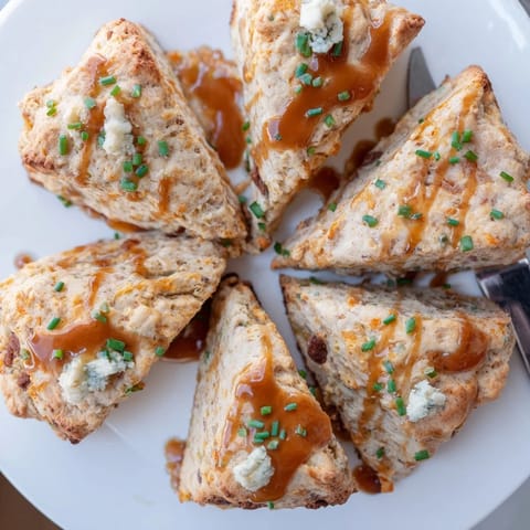 Freshly baked Buffalo Ranch Chai Caramel Biscuit Scones served warm on a rustic table.  