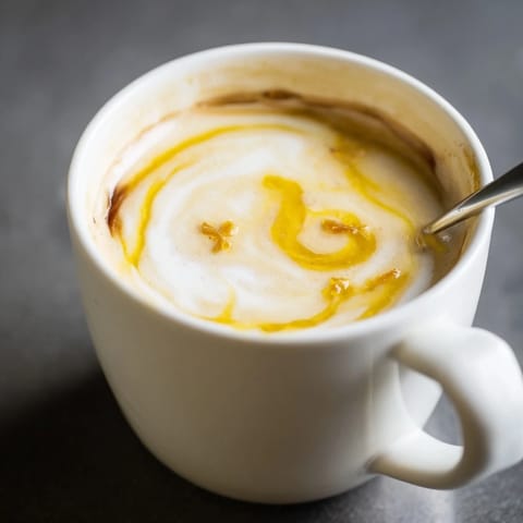 Bold onion latte blending caramelized onions with espresso for a savory delight.  