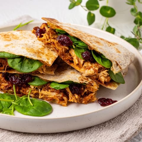 Golden-brown Moist Maker Chicken Wraps, toasted and ready to enjoy with a side of warm gravy.