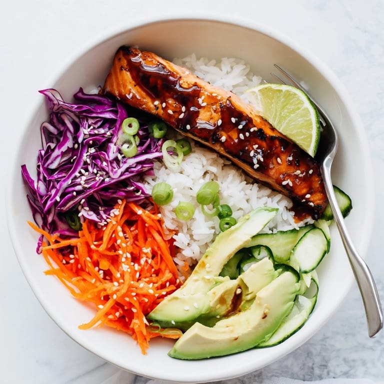 Savory sweet soy-maple salmon served over fluffy rice with vibrant vegetables.  