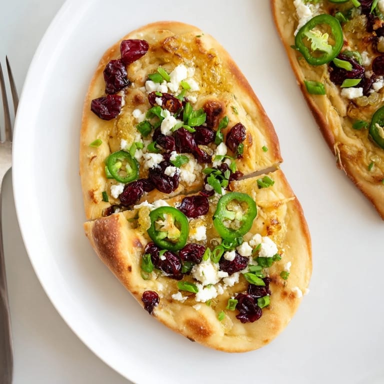 Zesty ginger cranberry jalapeño flatbread, golden-brown and bursting with flavor.