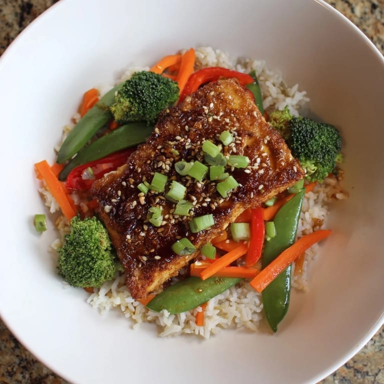 A close-up of beautifully seared tofu steaks, part of a delicious stir-fried meals with rice.