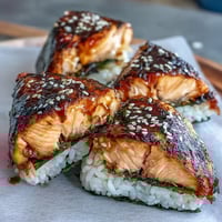 Grilled salmon onigiri with crisp golden rice and savory filling, perfect for a Japanese-inspired meal or snack.  